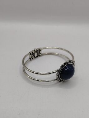 Vintage Silver Tone Hinged Cuff Bracelet with Blue Round Stone and Floral Border